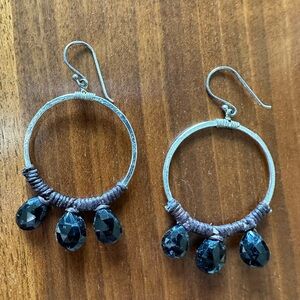 Sterling hoop earrings with black beads.